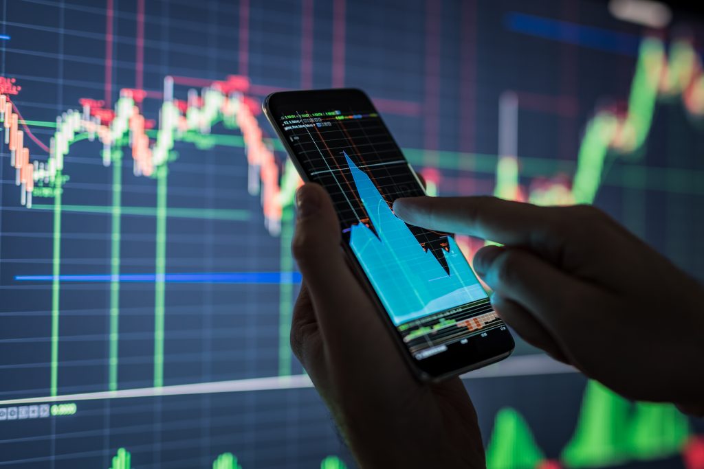 Businessman,Checking,Stock,Market,Data.,He,Using,A,Mobile,Phone.